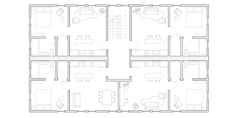 Floor plan showing four one-bedroom units around central stair and landing, showing back-to-back plumbing along a shared wet wall.