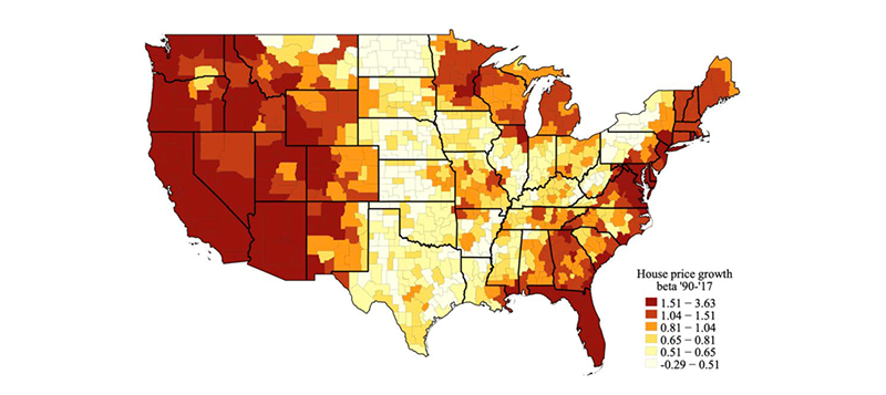 A map of all the commuting zones in the United States, showing darker colors for regions where house price growth co-varies more with national average growth. Darker colors are mainly shown along the Atlantic Coast, in Florida, the Great Lakes Region, and along the Pacific Coast and the Mountain States.