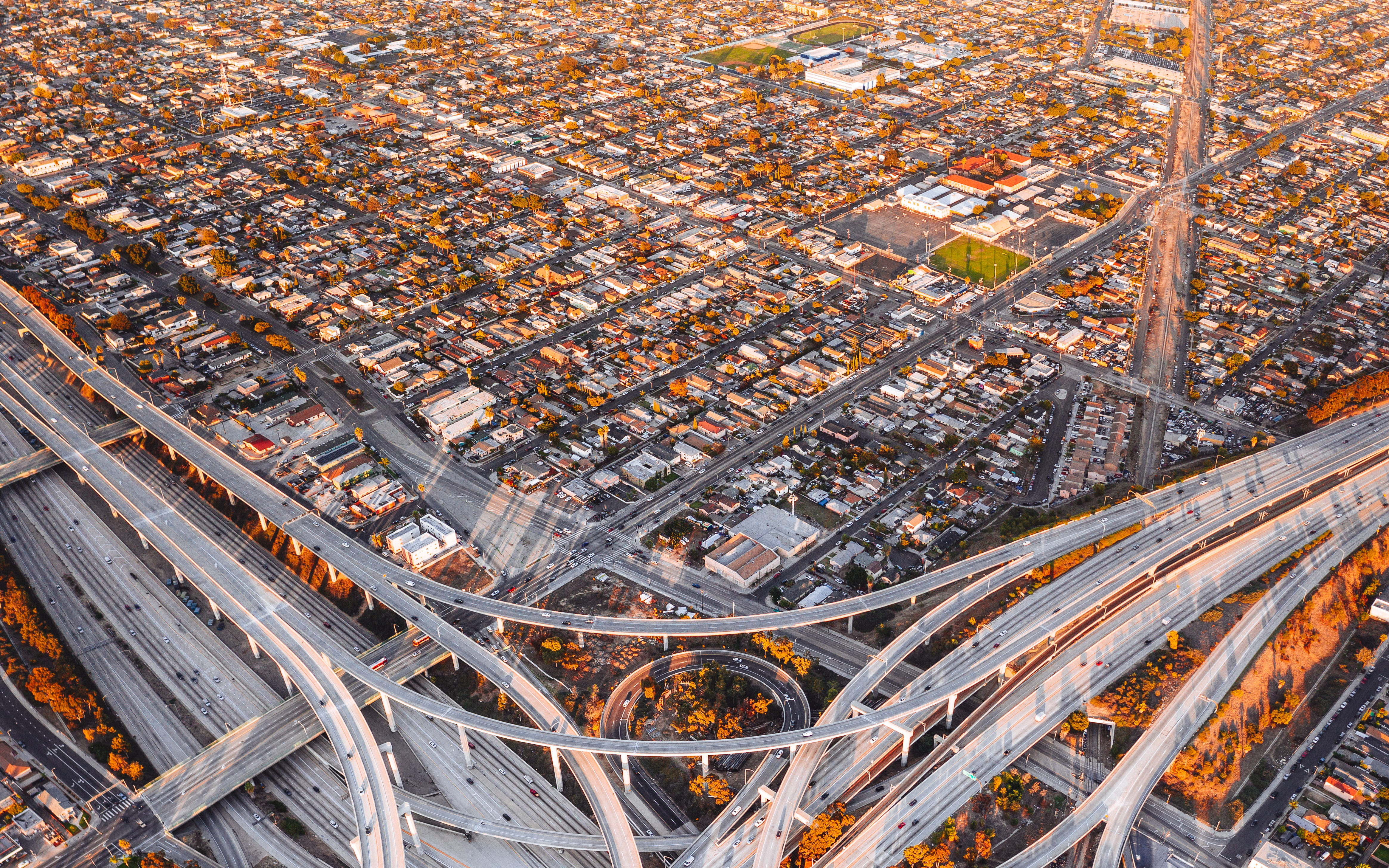Highway interchange in Los Angeles with view of residential neighborhood.