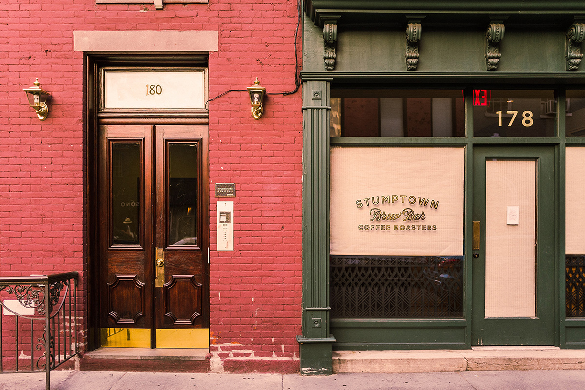View of empty storefront on street.