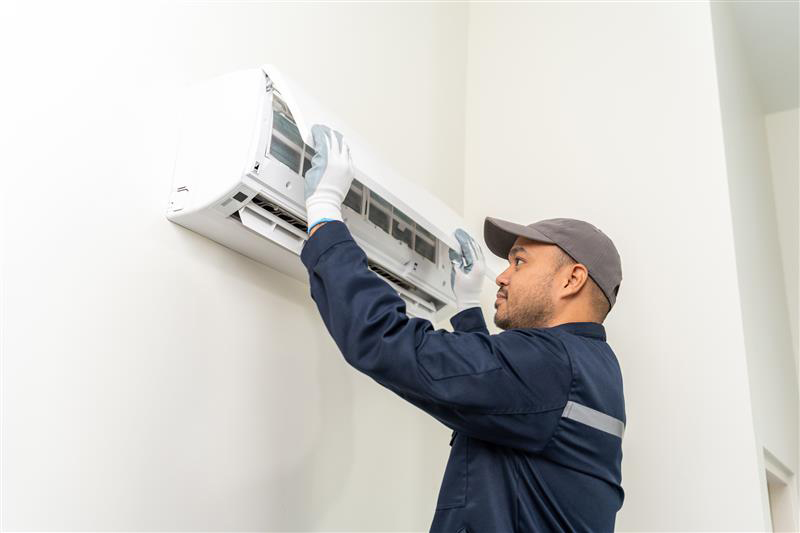 Technician working on a heat pump
