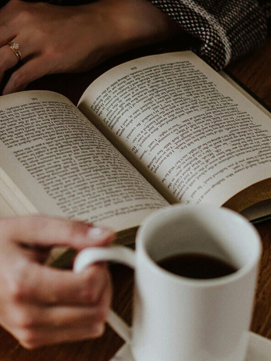 Person reading a book.