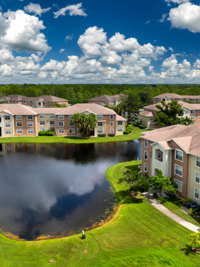 Apartment buildings next to a body of water.