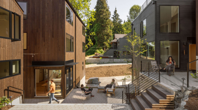 Attached modern homes surround a shared courtyard.