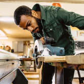 Man using a saw. 