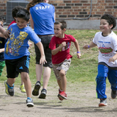 Children running on a playground.