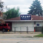 Home with Trump-Pence sign on roof.