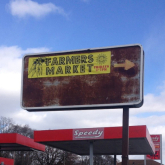 Sign advertising a farmers market in Brightmoor, Detroit. 