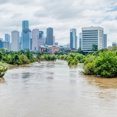 Flooded area with Houston skyline in the background.