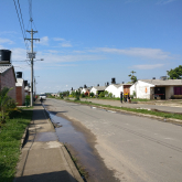 Rows of compact housing lining a street.
