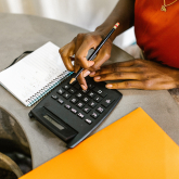 Woman using a calculator.