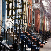 Rowhomes on a city street.