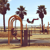 Child on playground swing.