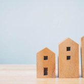 Three wooden block houses.