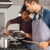 Couple cooking together.