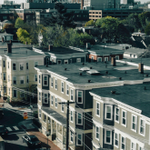 Aerial view of triple-decker homes.