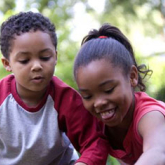 Kids playing in a yard.