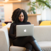 Woman using laptop. 