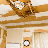 A dilapidated home under renovation.