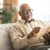 Older Black man reading