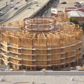 The New Carver Apartments housing under construction, showing wooden structure
