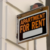 Apartment for rent sign.