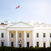Front of the US White House on a sunny day.