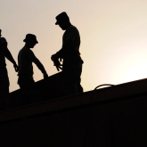 Workers on a roof