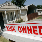 "Bank owner" sign in front of house.