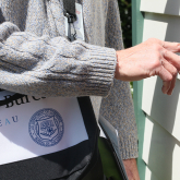Census worker ringing doorbell.