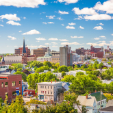 Coloful view of a city neighborhood with greenery.
