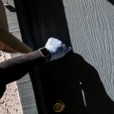 Person knocking on apartment door.