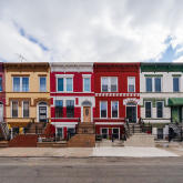 View of colorful townhouses in Brooklyn, NY.