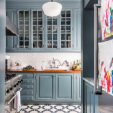 View of a kitchen with tile floor.