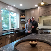Couple standing in their remodeled kitchen.