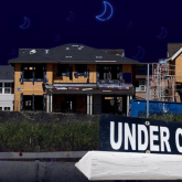 Houses with under construction sign.