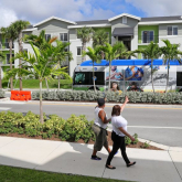 Multifamily homes along a street.