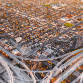 Highway interchange in Los Angeles with view of residential neighborhood.