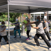 Residents at 2Life Communities performing Tai Chi.