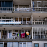 Multifamily apartment building with balconies.