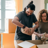 Couple unpacking their boxes after moving.