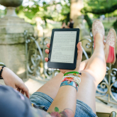 Person reading text on ereader.