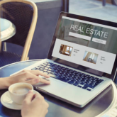 Person searching for online real estate.