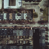 Aerial view of small apartment buildings.