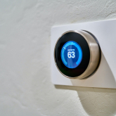 Smart thermostat on wall.