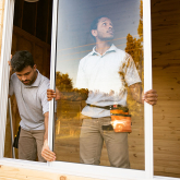 Contractors installing a new window