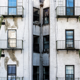 View of apartment building with water damage.