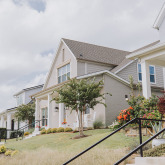 Row of houses with stairways in front.