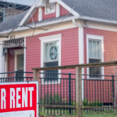 For-rent sign in yard.