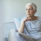 Older woman sitting on a chair